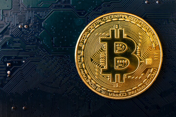 Golden coins with bitcoin symbol on blue mainboard circuit background. Cryptocurrency, Money coin digital. Blockchain technology, bitcoin mining concept, BTC
