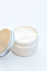 Jar with homemade cosmetics on white background. body treatment cosmetic white desk background top view space for text