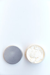 Jar with homemade cosmetics on white background. body treatment cosmetic white desk background top view space for text