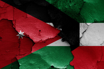 flags of Jordan and Kuwait painted on cracked wall