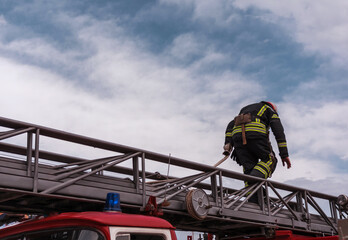  firefighter extinguishes with fire engine.