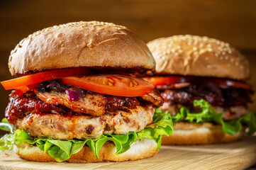 Close up of home made delicious burger on a wooden table.