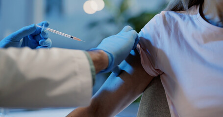 Laboratory old doctor doing vaccination procedure for young female patient. Antiviral medicine....