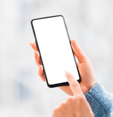 Hands working on mobile phone close up