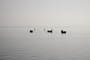 Naklejka premium Traditional fishing boats during toil