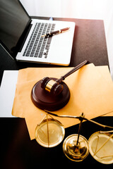 Close up of hand lawyer working signing contract paper with wooden gavel judge in the office. lawyer and law ,judiciary and legislature courtroom legal concept.
