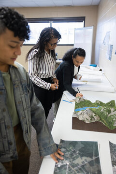 Community Looking At Urban Planning Maps And Models