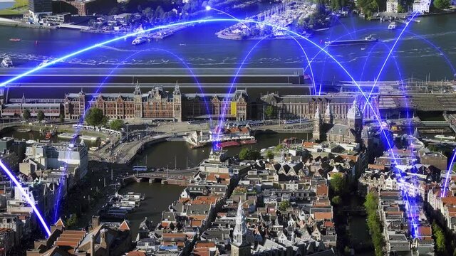 Holographic arches over a futuristic aerial view of Downtown Amsterdam, Netherlands. Blue holographic lines connecting the city. Amsterdam central station. 