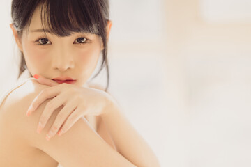 Headshot portrait of young asian woman sexy girl with long hair using as background cosmetics woman makeup fashion people model