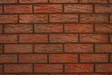 The wall of decorative facing bricks. Close-up Fragment