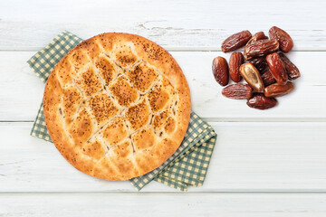 Ramadan pita and date on table