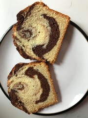 Happy marble cake, two slices on a plate looking like smiling faces