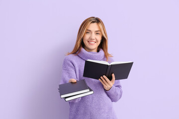 Woman with books on color background