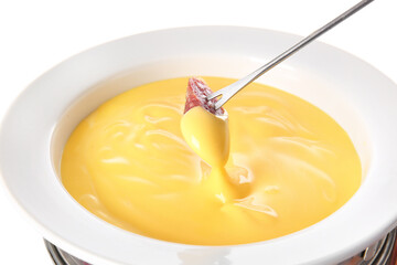 Stick with sausage dipped into cheese fondue on white background