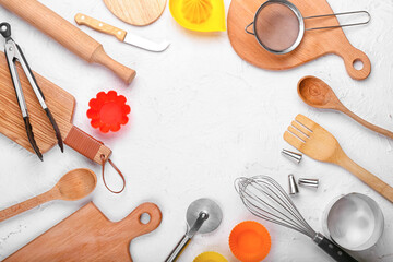 Frame made of kitchen utensils on light background