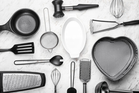 Set of kitchen utensils on light background