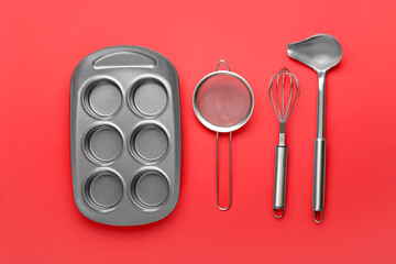 Set of kitchen utensils on color background