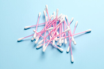 Cotton swabs on color background