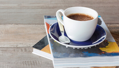 White coffee cup on a blue saucer