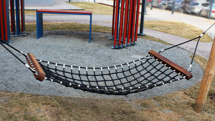 Hammock swing for children on the playground © sabdiz
