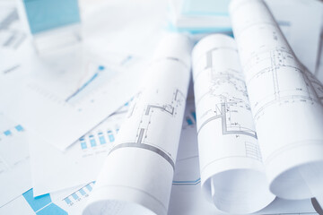 Business project documentation, development, planning and approval. Construction drawings for building, apartment, financial diagrams, investment plan, documents. Making repairs. Blurred background