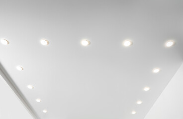 White ceiling with spot lamps in room, low angle view