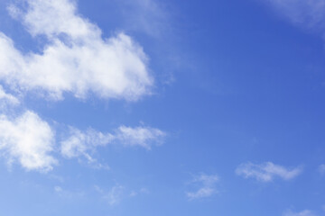 Naklejka na ściany i meble Beautiful blue sky with white clouds outdoors