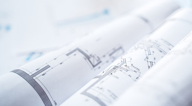 Business project documentation, development, planning and approval. Construction drawings for building, apartment, financial diagrams, investment plan, documents. Making repairs. Blurred background