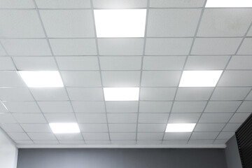 White ceiling with lighting in office room