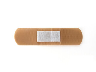 view of Medical patch, adhesive bandage in horizontal position isolated on white background. Protective tape strip, wound patch close up. First aid adhesive plaster. Sanitary concept.