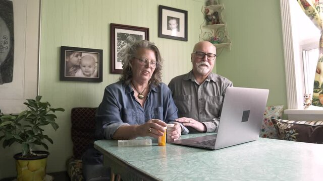 Senior Couple Seeking Medical Advice On Video Call