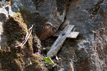 Wooden cross is placed in the corner of the cliff, symbolizing the mourning of veterans.