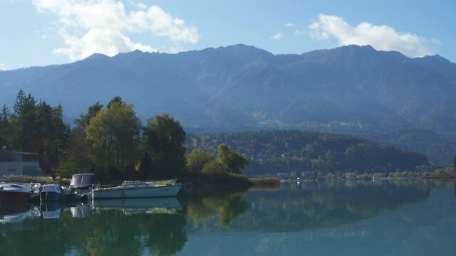 autumn view of austrian lake Faakersee from the viewpoint at the sunny october day

