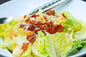 Caesar Salad with crispy roasted bacon and crisy bread.
