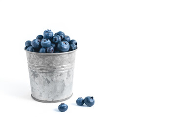blue blueberry in a bucket on a white background