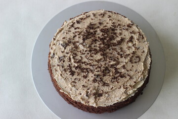 Chocolate cake with vanilla butter icing mixed with chocolate as the topping.