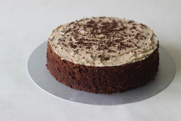 Chocolate cake with vanilla butter icing mixed with chocolate as the topping.