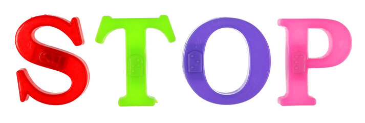 The word stop is lined with multi-colored plastic letters, white background, isolate.