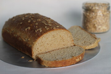 Slices of bread baked with whole wheat and oats.