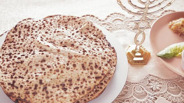 Matza shmura round for Easter seder next to kiara rotates in a circle. Close-up