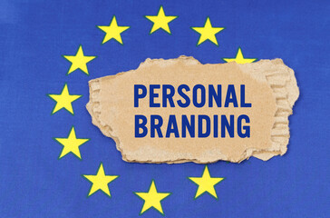 There is a cardboard box on the EU flag that says- PERSONAL BRANDING