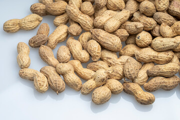inshell peanuts close-up, organic peanuts top view