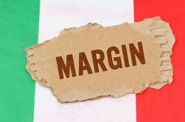 Against the background of the flag of Italy lies cardboard with the inscription - margin