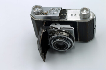 Vintage photo camera on white background