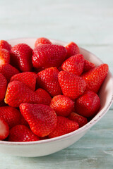 fresh strawberries in a ceramic bowl