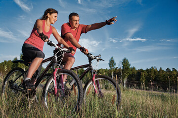 Fototapeta na wymiar mature couple riding bicycle