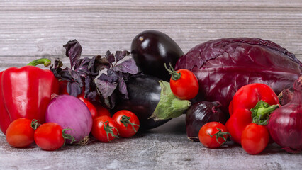stripe from red and purple ripe vegetables on wooden table