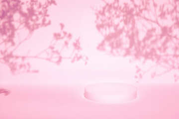 Abstract minimal nature scene - empty stage and cylinder podium on pink background, soft shadow of tree leaves on white wall. Pedestal for cosmetic product and packaging mockups display presentation