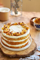 Banana cake with caramel. Wooden background, side view.