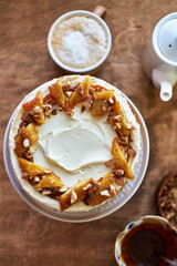 Banana cake with caramel. Wooden background, top view.